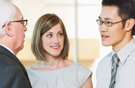 Two co-op students talking to a manager